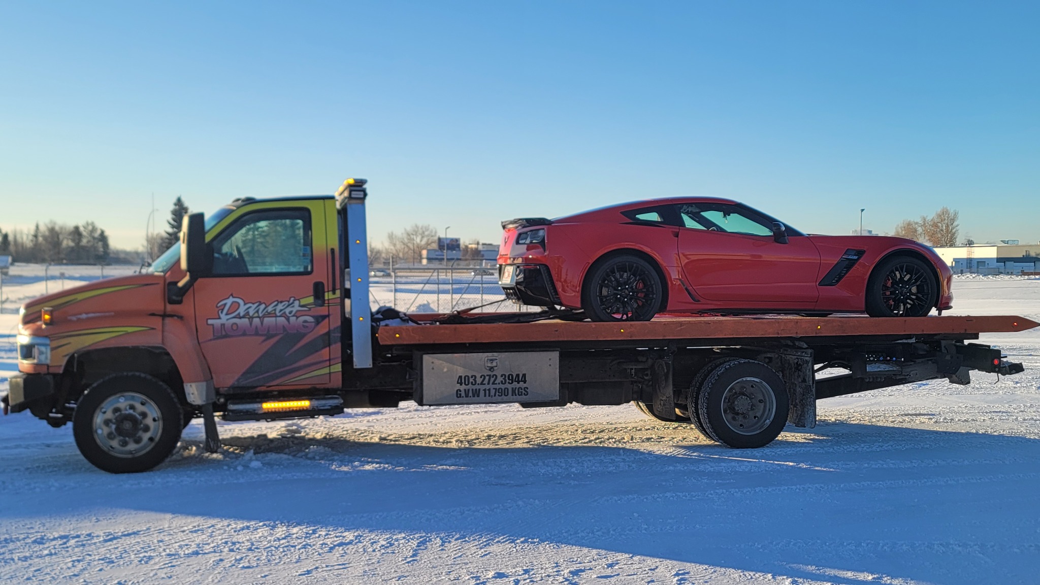 Red Corvette transported in winter conditions – Calgary