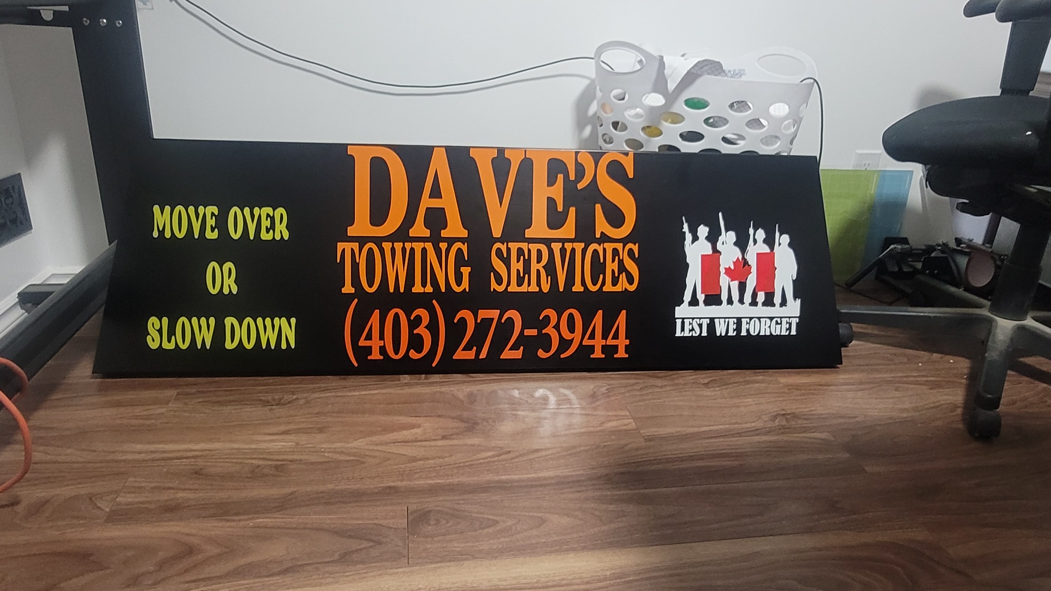 Dave's Towing Services safety sign: Move Over or Slow Down – Calgary