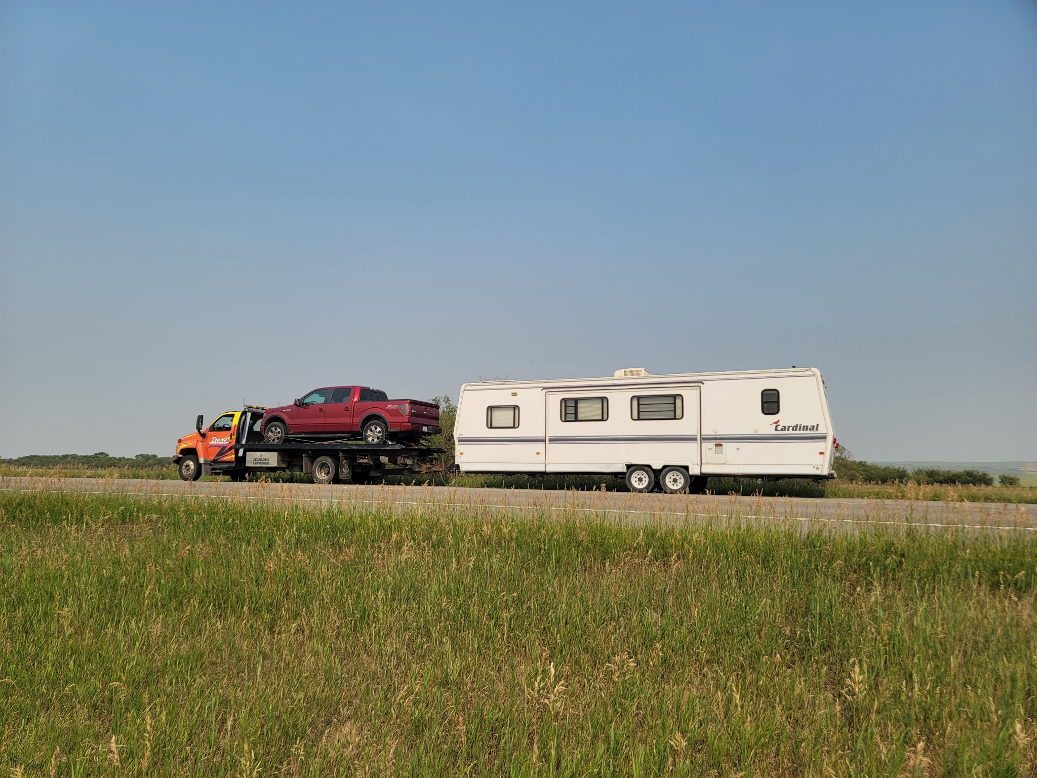 Long-distance tow: Ford F‑150 and travel trailer outside Calgary