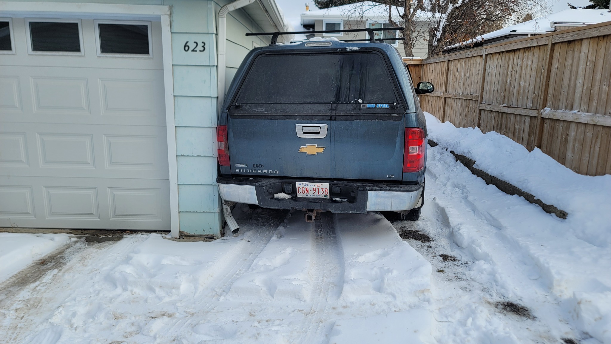 Tight driveway winch-out for Chevy Silverado – Calgary (before)