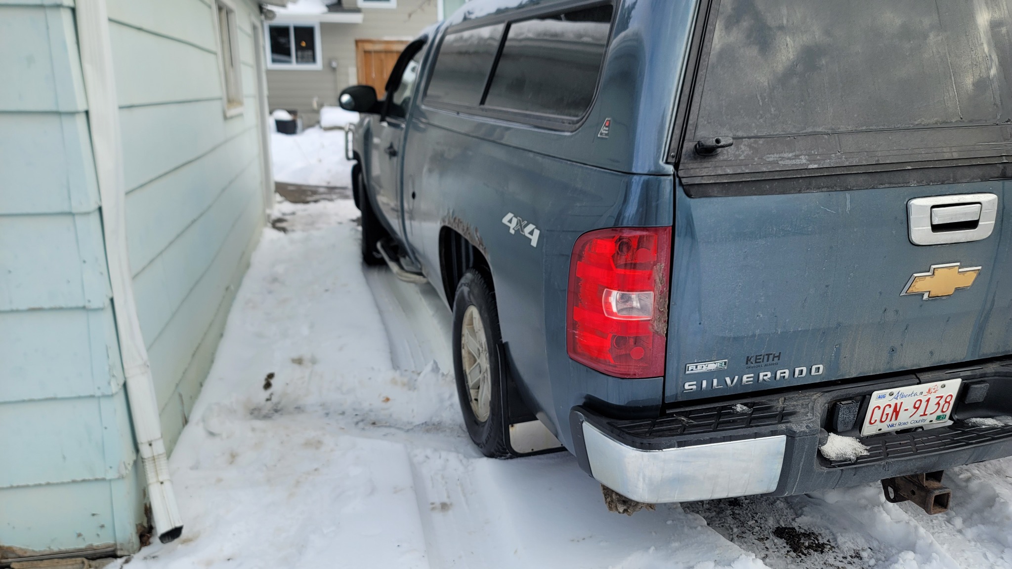 Tight driveway winch-out for Chevy Silverado – Calgary (during)