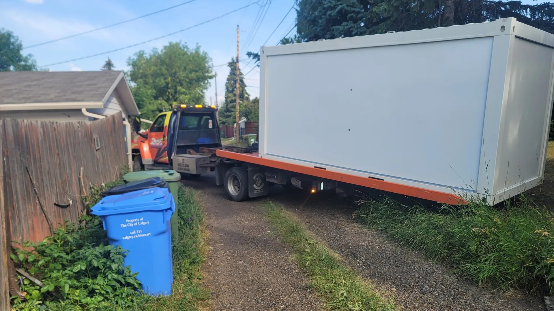 Oversize shed/portable building delivery through Dave's Towing Services alley