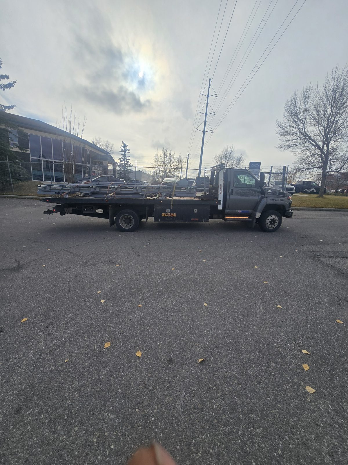 Dave's Towing: Auto Body Frame Machine Flatbed Transport in Calgary