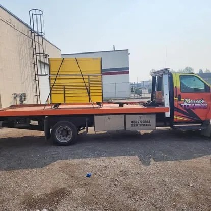 Dave's Towing: Equipment Box Flatbed Transport in Calgary