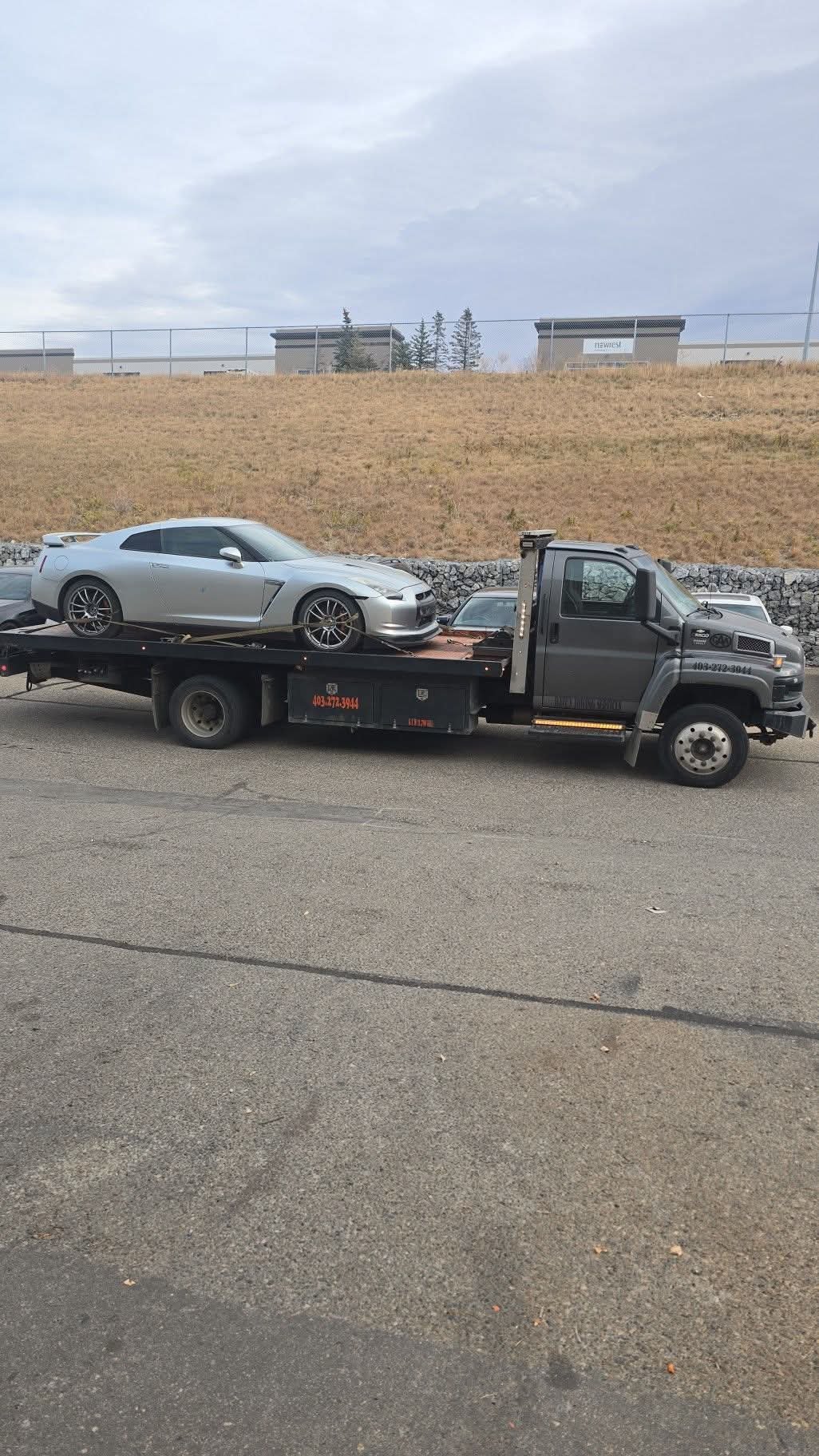Dave's Towing: Silver Nissan GT-R Flatbed Tow in Calgary - Flatbed Towing in Calgary