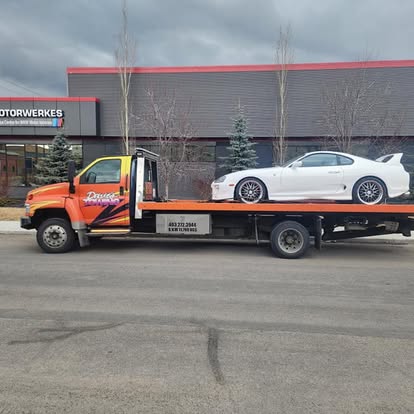 Dave's Towing: White Toyota Supra Flatbed Tow in Calgary